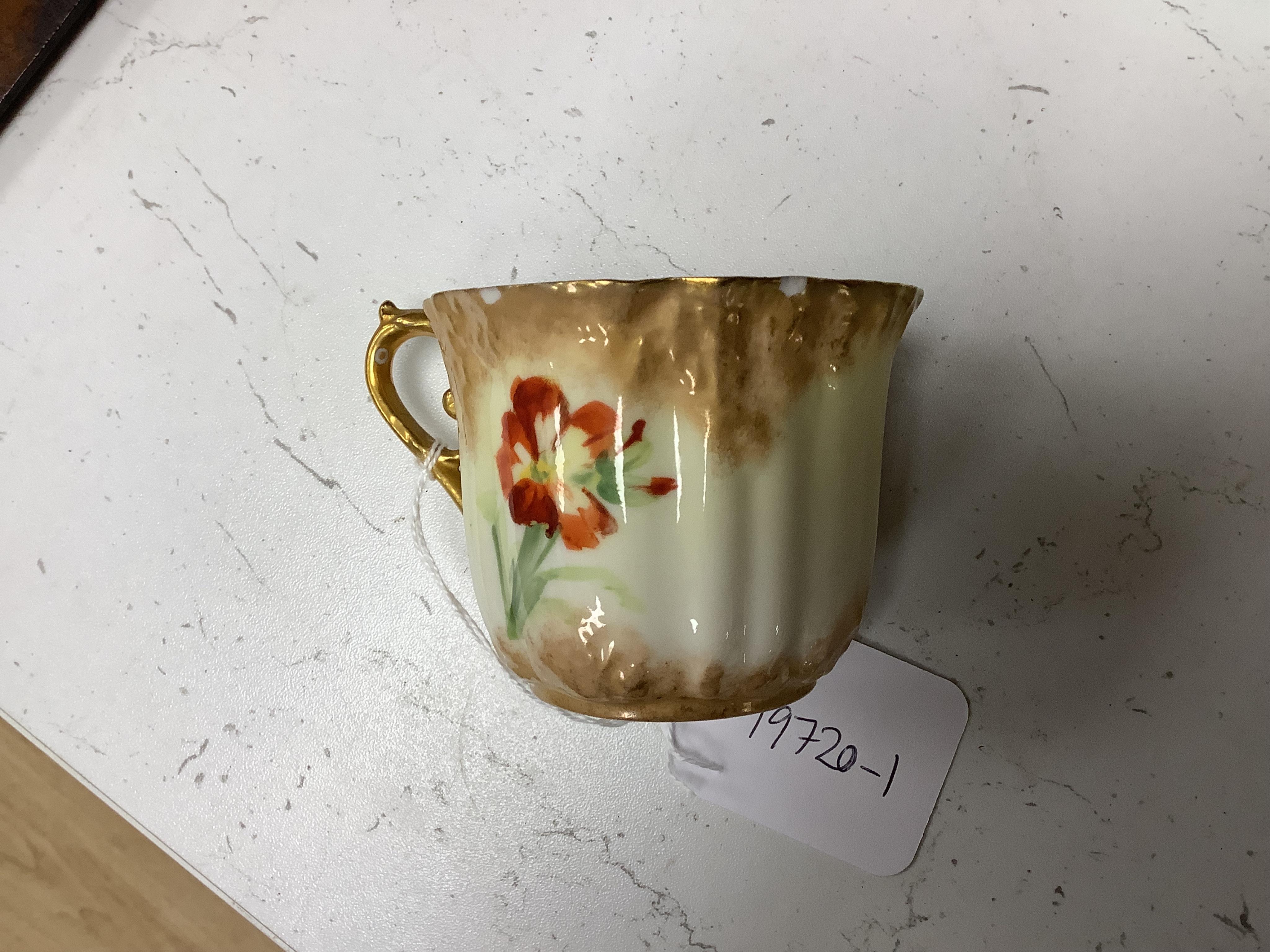 A ‘Nautilus’ porcelain floral and gilt decorated tea service, sandwich plates 23cm diameter.